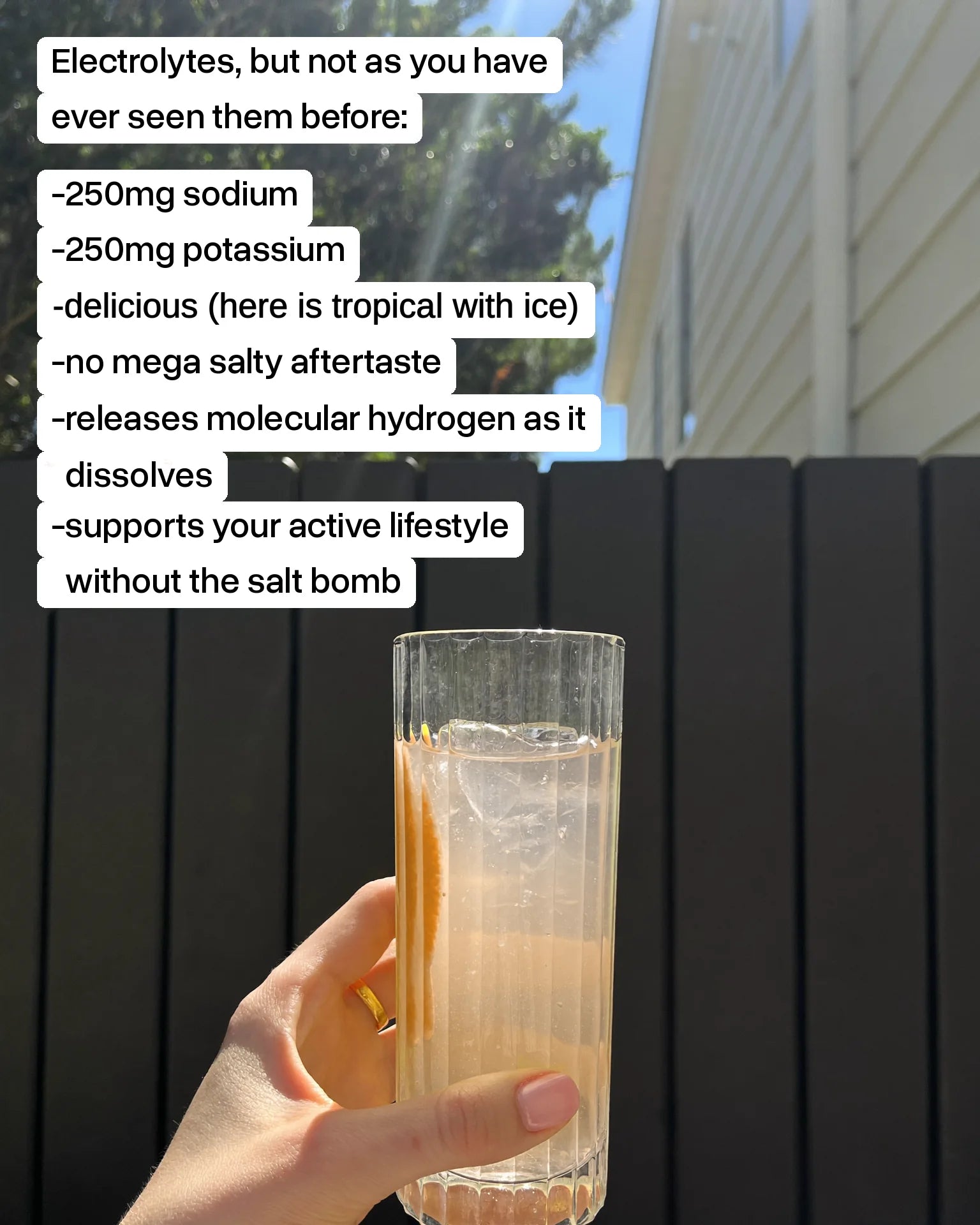 A glass of Base 250 Tropical over ice