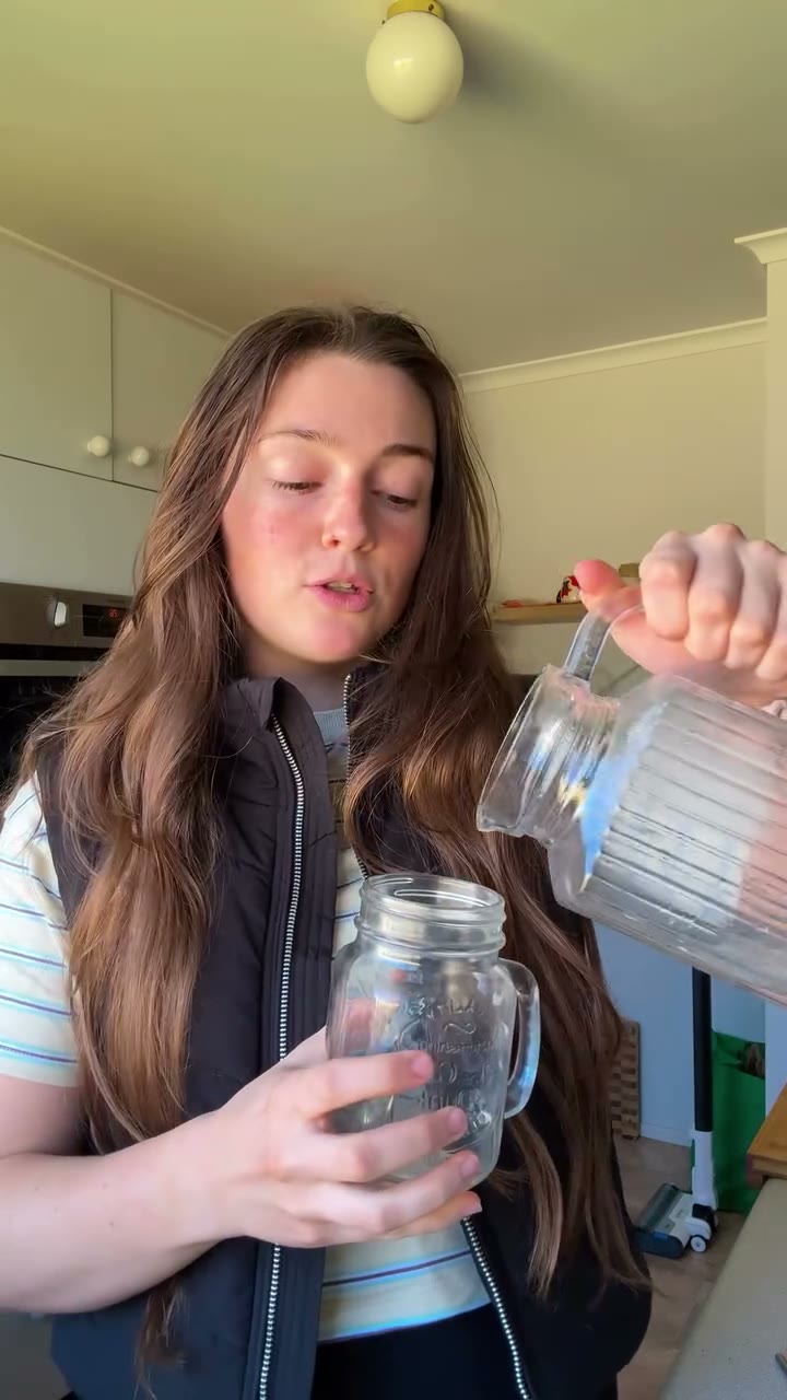 A customer holding a Base 250 sachet