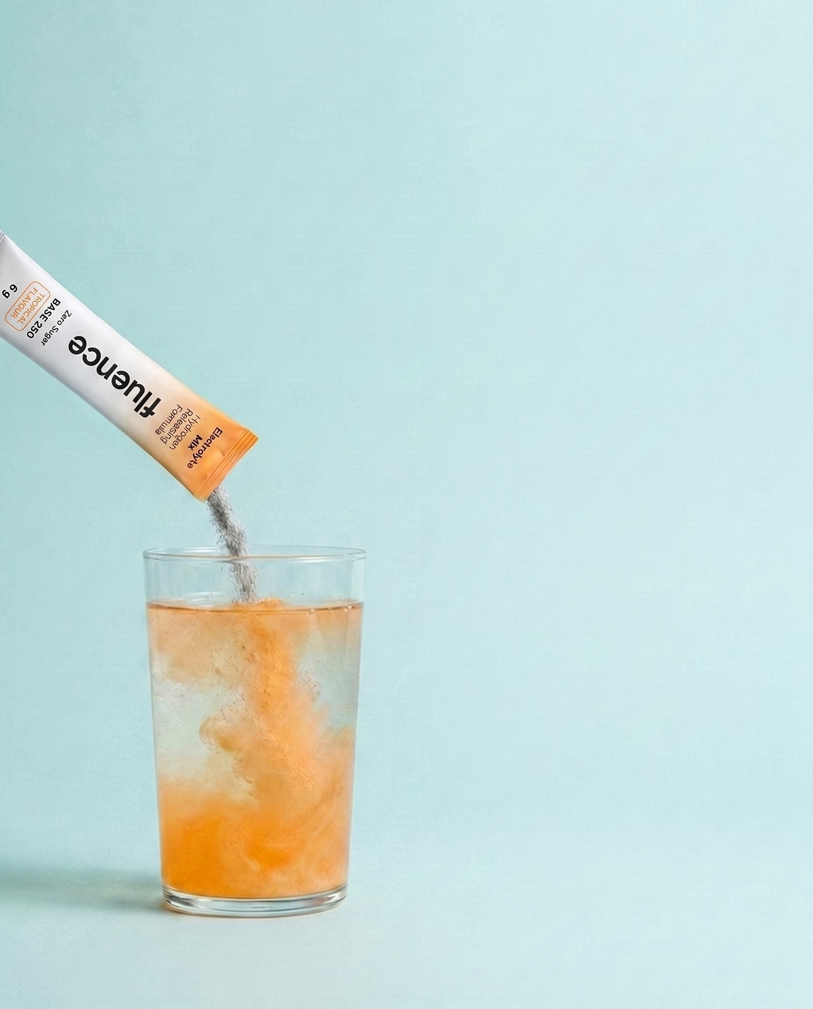 Base 250 electrolyte powder pouring into a glass of water