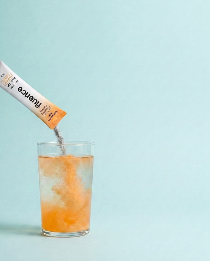 Base 250 electrolyte powder pouring into a glass of water