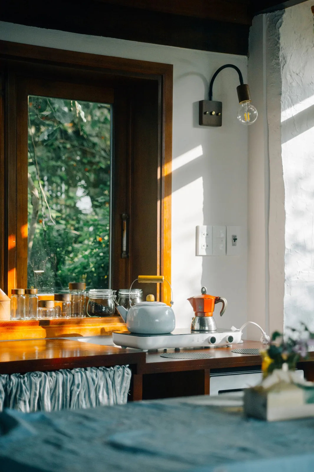 A kitchen bench in morning window light