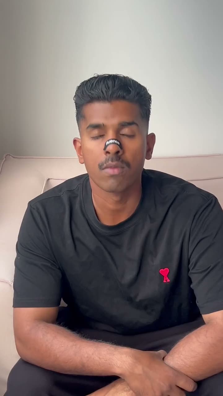 A man wearing a black Fluence nasal strip