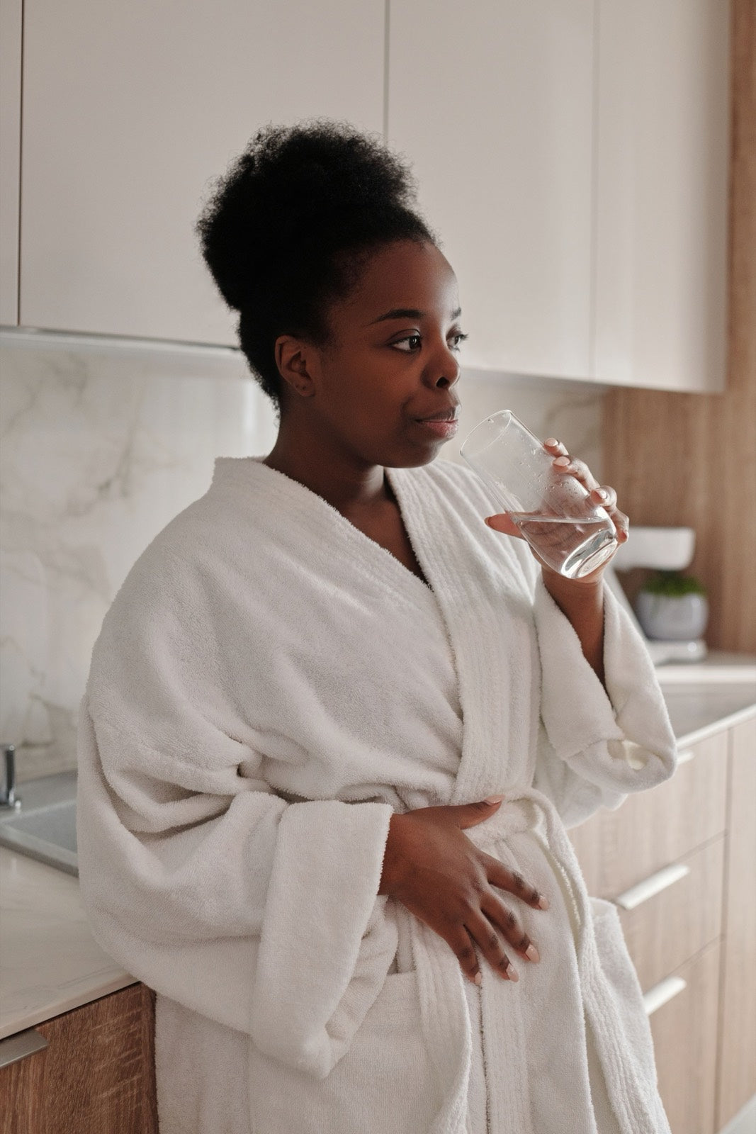 Making the first drink of the morning in a bright kitchen