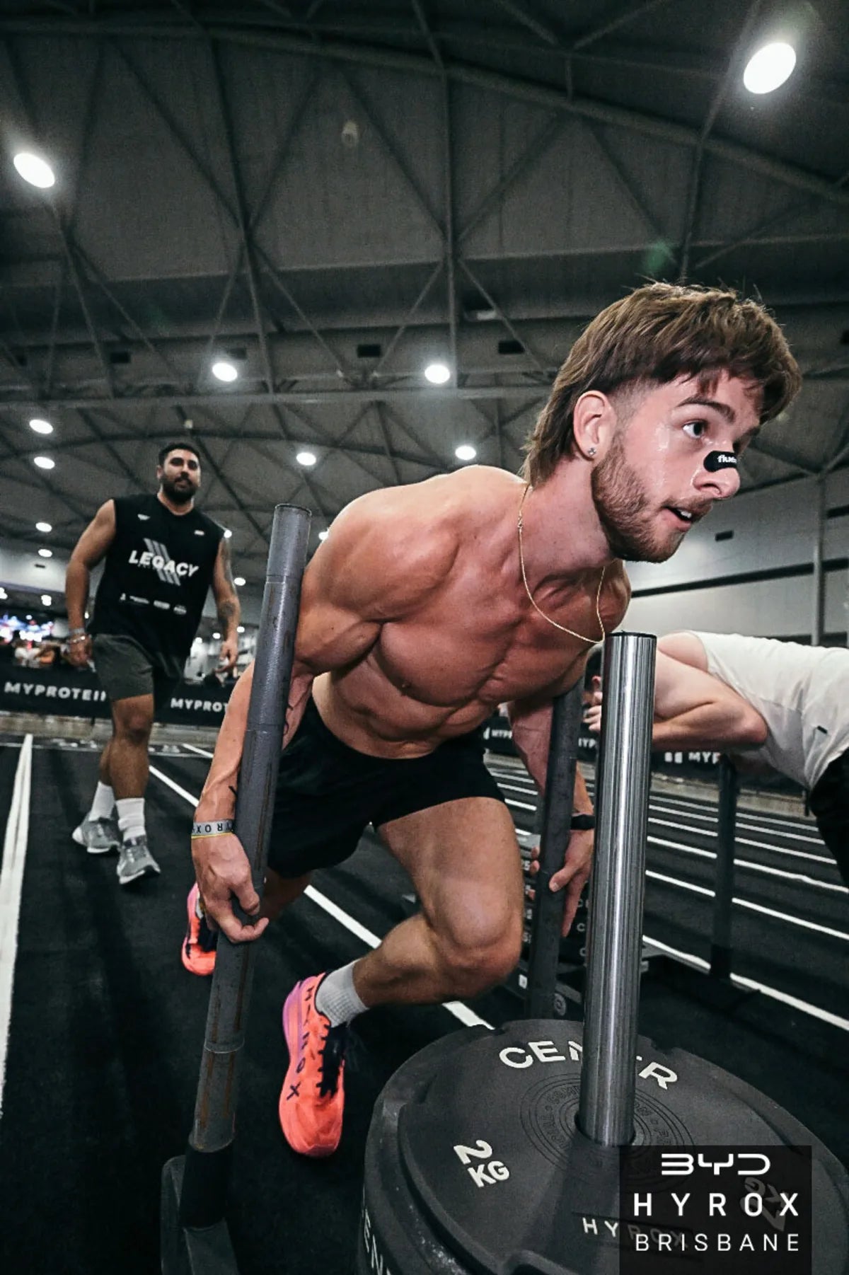 Killian wearing a Fluence nasal strip on the sled push at Hyrox Brisbane